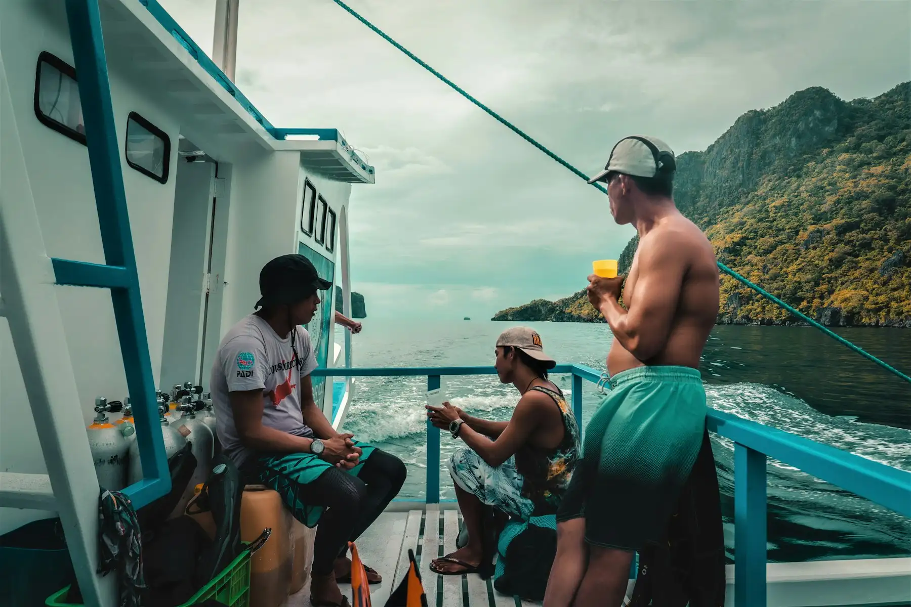 Guests relaxing on the deck of a boat on a sunny day